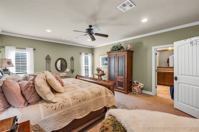 carpeted bedroom with crown molding, ensuite bathroom, a textured ceiling, and ceiling fan