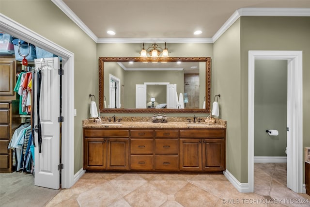 bathroom with tile patterned floors, toilet, crown molding, vanity, and walk in shower