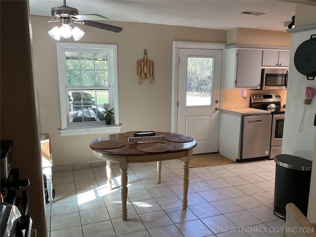 kitchen with a healthy amount of sunlight, visible vents, appliances with stainless steel finishes, and light countertops