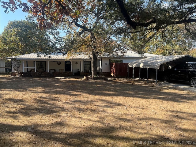 rear view of house with a porch