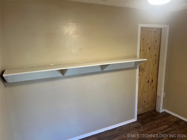 interior details with wood finished floors and baseboards