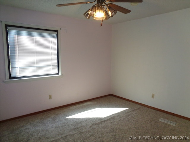 carpeted empty room with ceiling fan