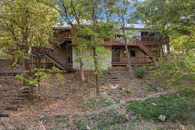 rear view of property with a deck