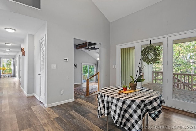 dining room featuring plenty of natural light, high vaulted ceiling, and dark hardwood / wood-style floors