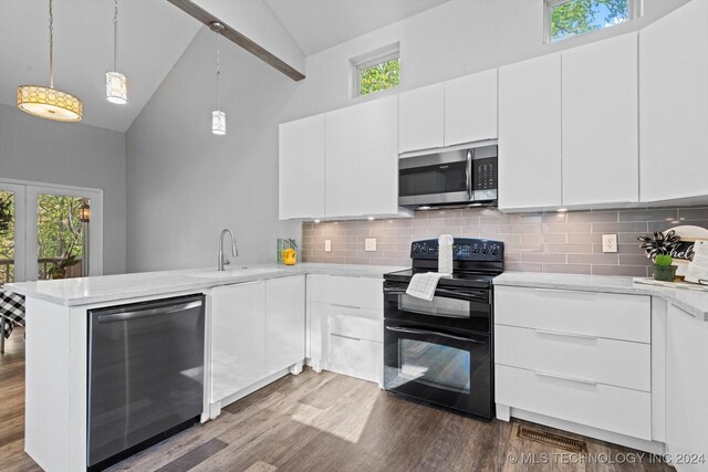 kitchen featuring black / electric stove, white cabinets, and high vaulted ceiling