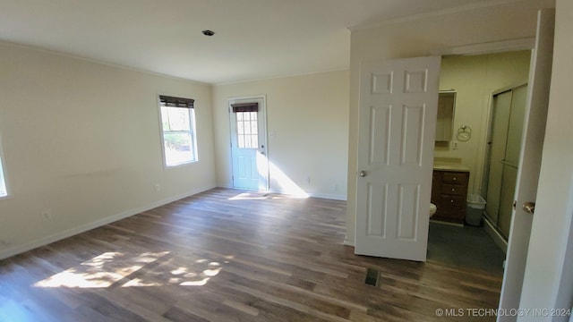 unfurnished room featuring dark hardwood / wood-style flooring