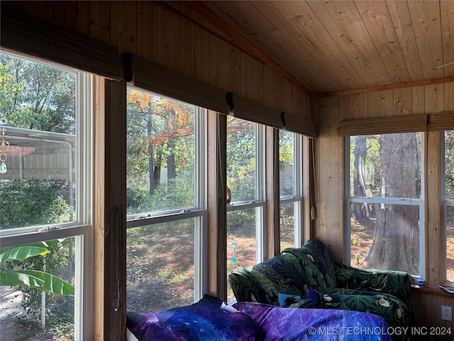 sunroom with wood ceiling and a wealth of natural light