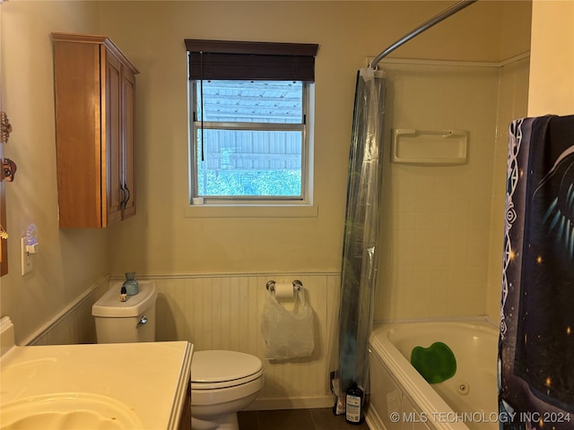 full bathroom with toilet, tile patterned floors, vanity, and shower / tub combo with curtain