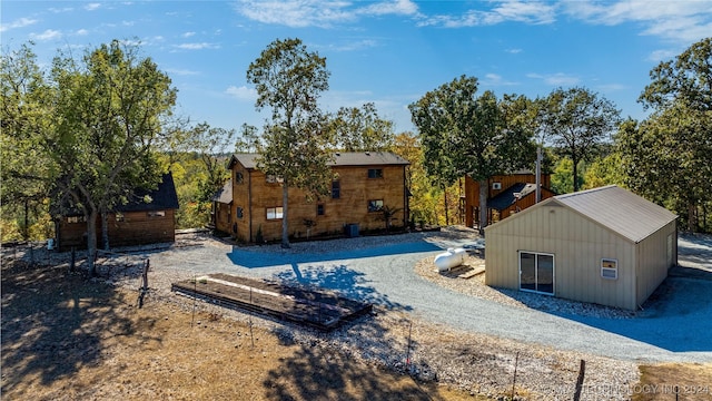 rear view of house featuring central air condition unit