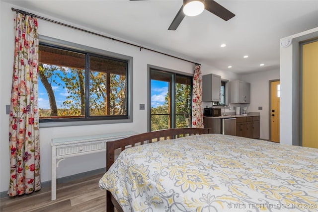 bedroom featuring light hardwood / wood-style flooring and sink