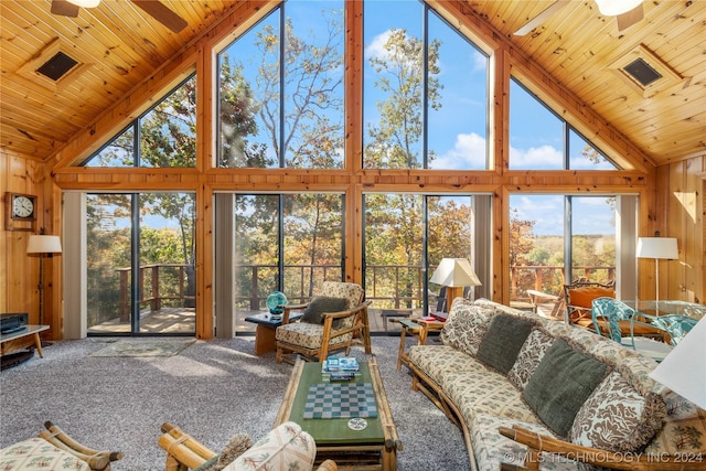 living room with carpet flooring, ceiling fan, wooden ceiling, and high vaulted ceiling