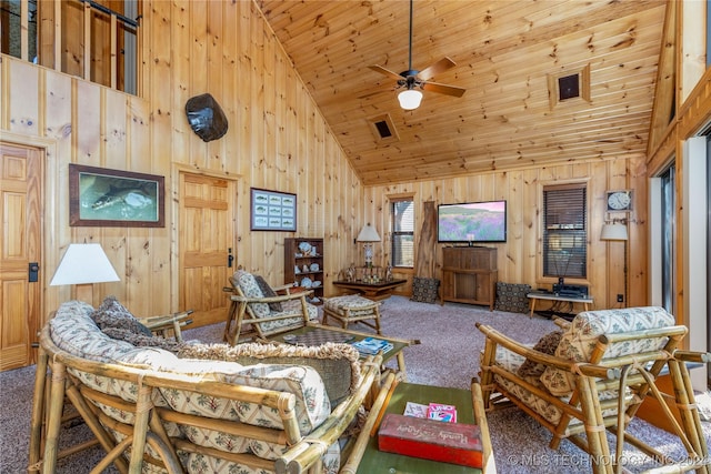 living room featuring ceiling fan, carpet, and high vaulted ceiling