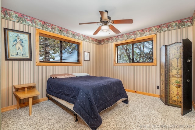 carpeted bedroom featuring ceiling fan