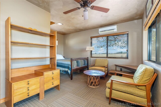 bedroom featuring a wall mounted AC, ceiling fan, and carpet floors