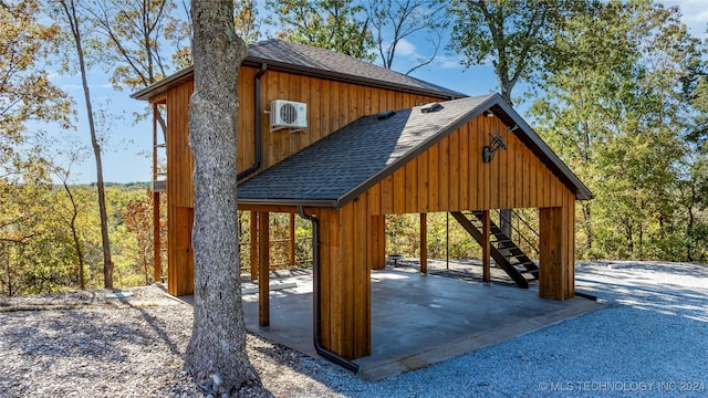 exterior space with ac unit and a patio area