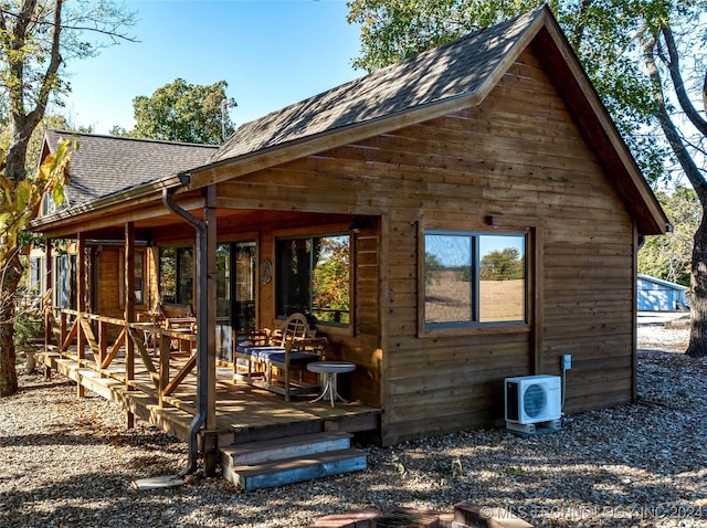 back of house featuring ac unit