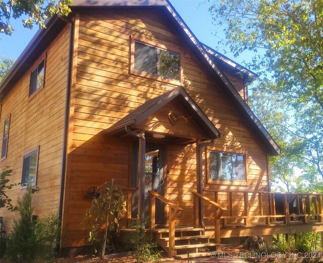 exterior space featuring a wooden deck