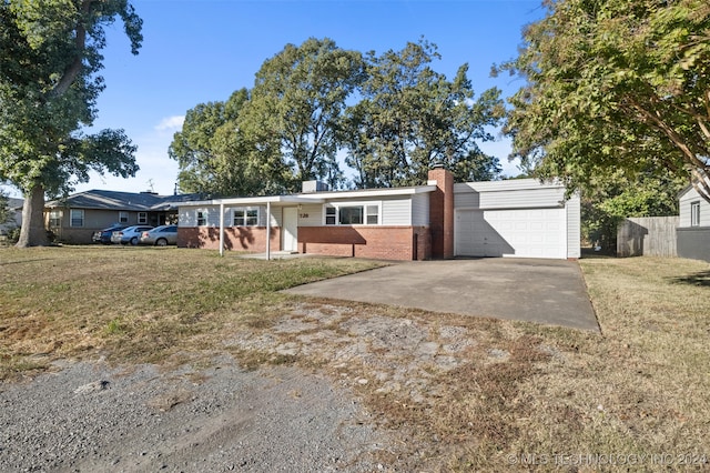 single story home with a front lawn and a garage