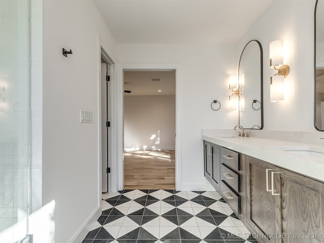 bathroom with vanity and wood-type flooring