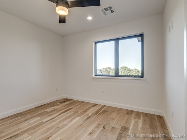 unfurnished room featuring ceiling fan and light hardwood / wood-style flooring