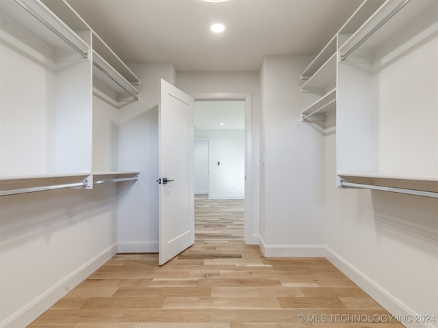 walk in closet featuring light wood-type flooring