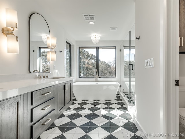 bathroom with vanity, separate shower and tub, and tile patterned flooring