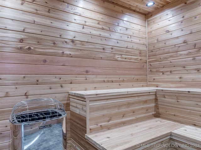 view of sauna / steam room featuring wooden walls