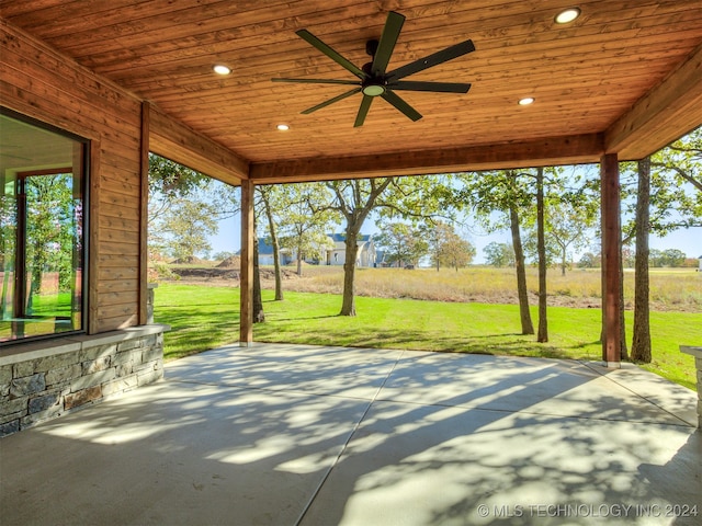 view of patio / terrace featuring ceiling fan and a rural view