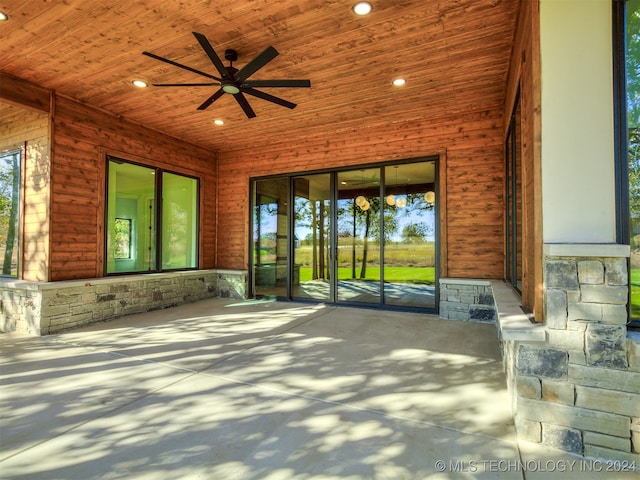 view of patio featuring ceiling fan