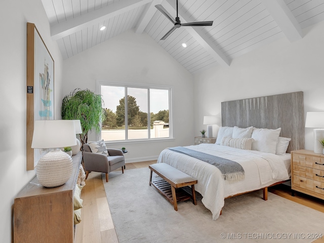 bedroom with wood ceiling, light hardwood / wood-style floors, ceiling fan, beamed ceiling, and high vaulted ceiling