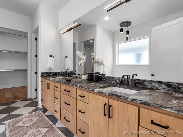 bathroom featuring vanity and hardwood / wood-style flooring