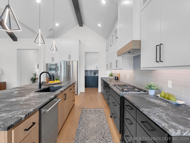 kitchen with backsplash, white cabinetry, beamed ceiling, pendant lighting, and light hardwood / wood-style flooring