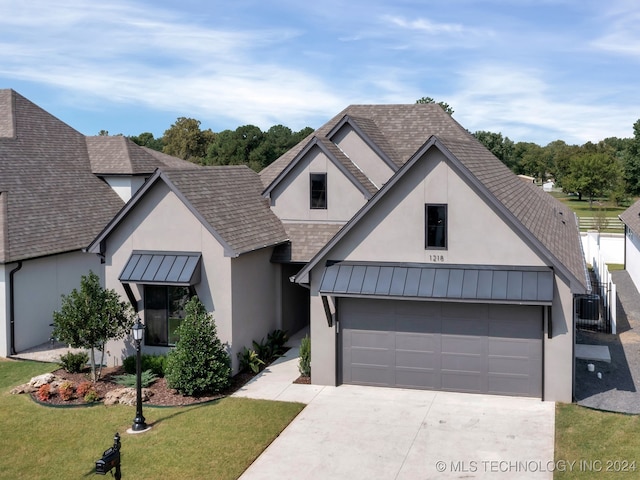 view of front facade featuring a front lawn and a garage