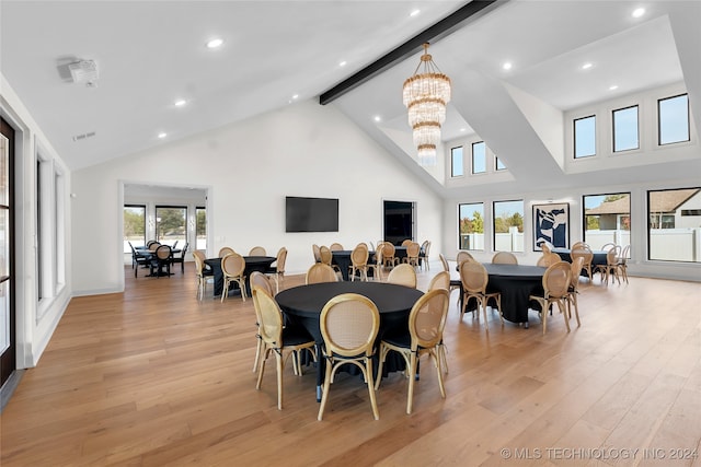 dining space with beamed ceiling, light hardwood / wood-style flooring, high vaulted ceiling, and a notable chandelier