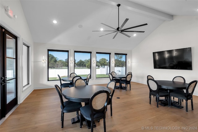 dining space with beam ceiling, ceiling fan, high vaulted ceiling, light hardwood / wood-style floors, and french doors