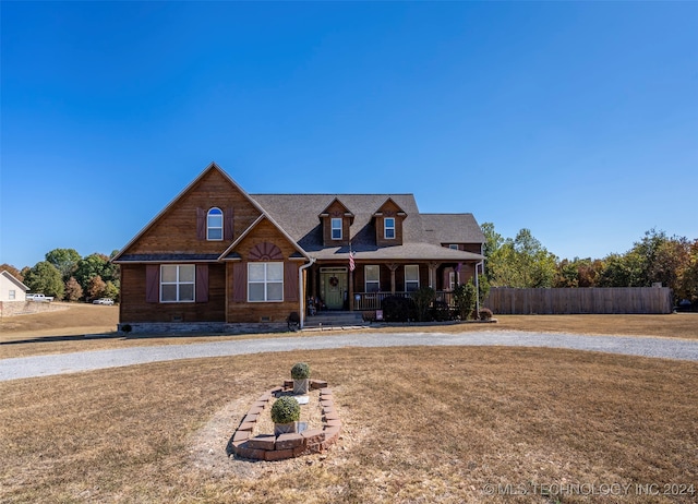 view of front of property featuring a porch and a front lawn