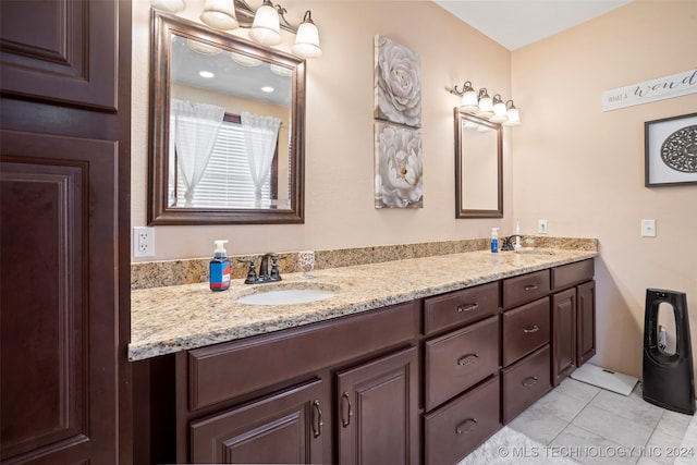 bathroom featuring vanity and tile patterned flooring