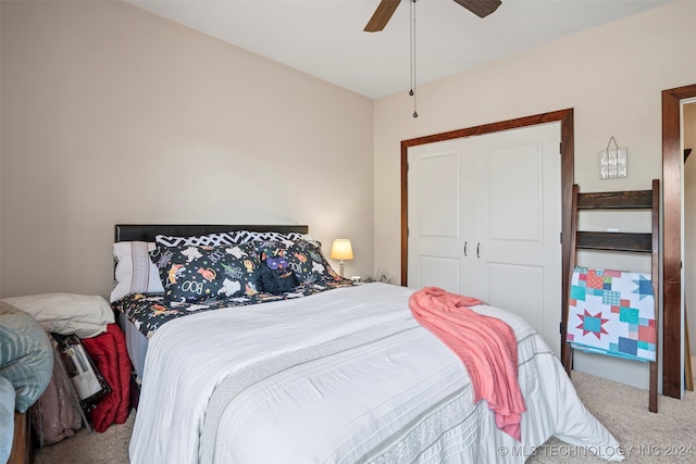 carpeted bedroom featuring a closet and ceiling fan