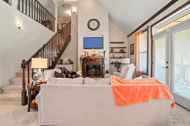 living room featuring french doors, crown molding, high vaulted ceiling, and light colored carpet