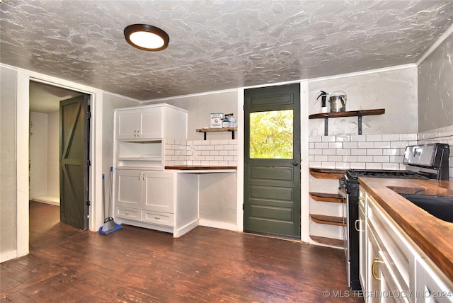 kitchen with white cabinetry, wooden counters, dark hardwood / wood-style floors, and gas stove