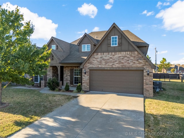 craftsman inspired home with cooling unit and a front yard