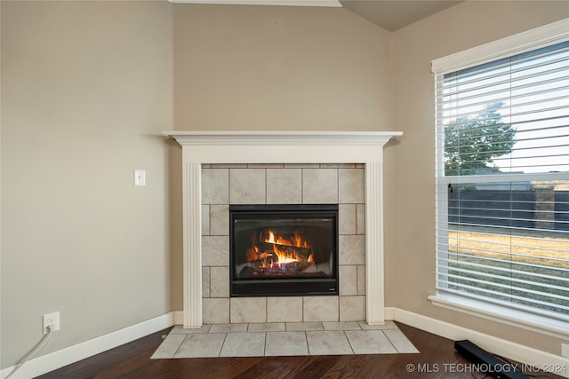 interior details featuring hardwood / wood-style floors and a fireplace