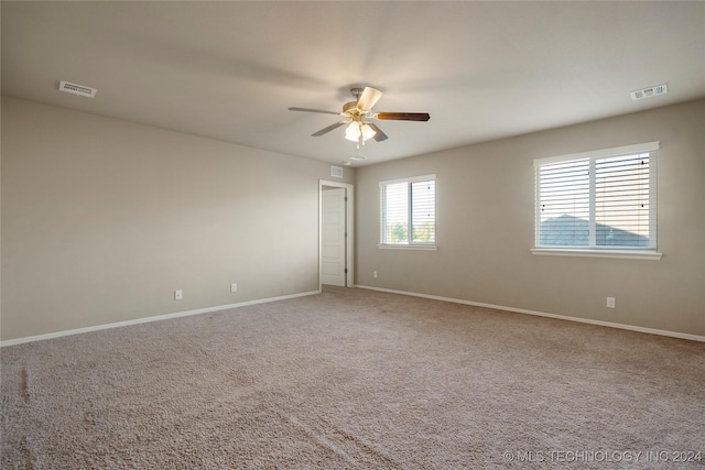 15410 E 87th St, Owasso, OK 74055 - unfurnished room featuring ceiling fan, carpet floors, and baseboards