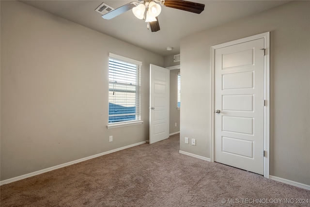 unfurnished bedroom with carpet flooring and ceiling fan