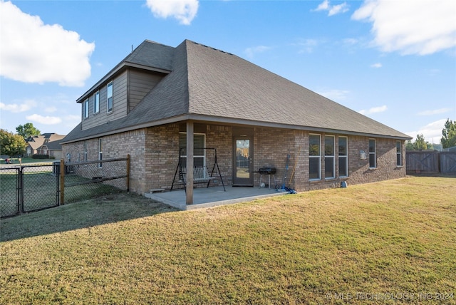 15410 E 87th St, Owasso, OK 74055 - back of property featuring a gate, brick siding, and a patio