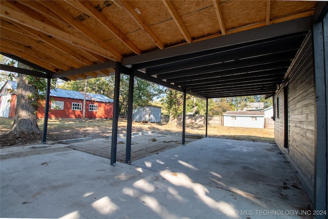 view of patio / terrace featuring a storage shed