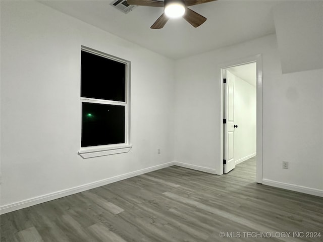 spare room with light hardwood / wood-style floors and ceiling fan