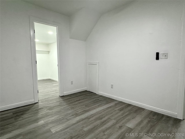 additional living space with dark hardwood / wood-style floors