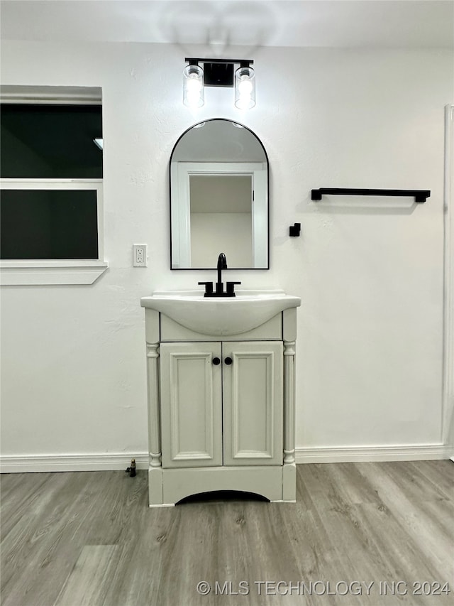 bathroom featuring vanity and wood-type flooring