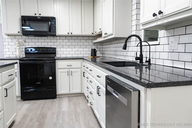 kitchen featuring white cabinets, black appliances, sink, and light wood-type flooring